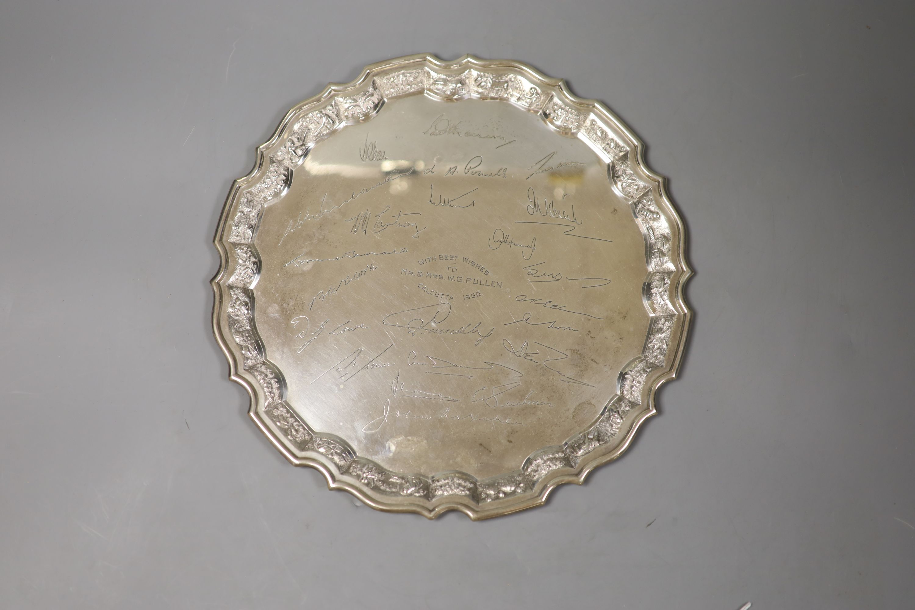 An Indian Sterling white metal salver engraved with signatures,